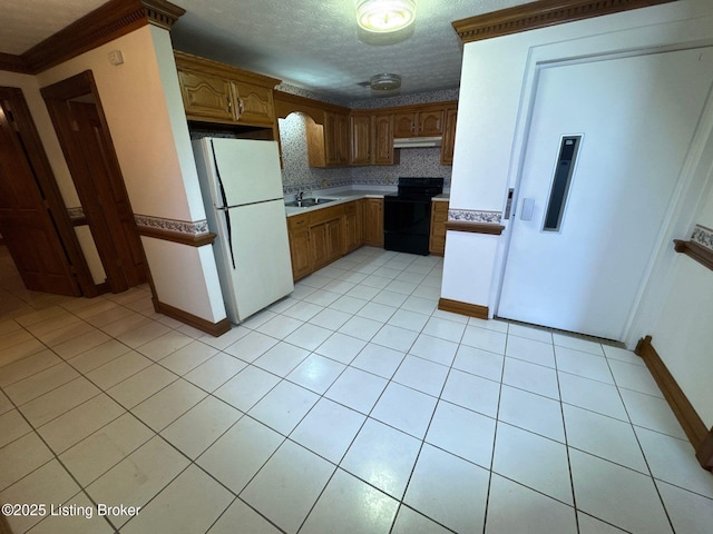 5309 Bardstown Rd, Springfield, KY 40069 - kitchen with freestanding refrigerator, black electric range oven, light tile patterned floors, under cabinet range hood, and brown cabinets