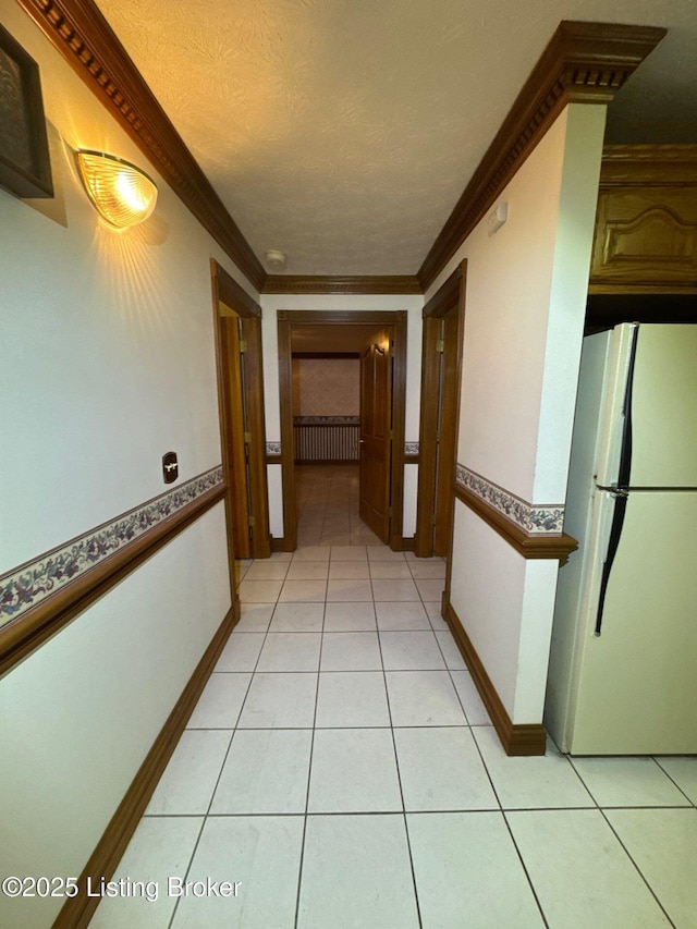 5309 Bardstown Rd, Springfield, KY 40069 - hallway with light tile patterned flooring, ornamental molding, and a textured ceiling