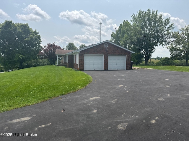 5309 Bardstown Rd, Springfield, KY 40069 - view of side of property featuring a lawn, driveway, brick siding, and an attached garage