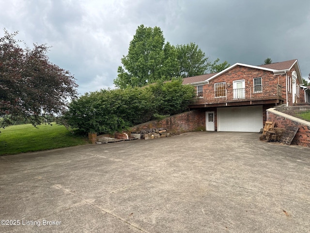 5309 Bardstown Rd, Springfield, KY 40069 - view of front of home with brick siding, an attached garage, and driveway