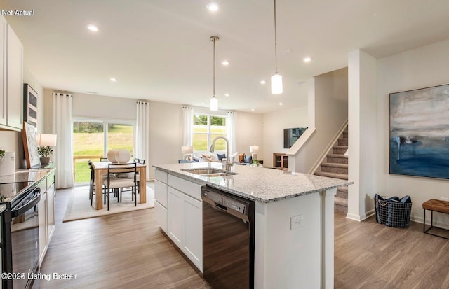 1853 Washington Blvd, Lyndon, KY 40242 - kitchen featuring black appliances, a sink, light wood-type flooring, light stone countertops, and white cabinetry