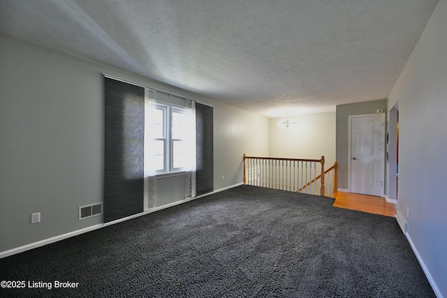 7514 Pimlico Dr, Louisville, KY 40214 - spare room with a textured ceiling, carpet, and baseboards