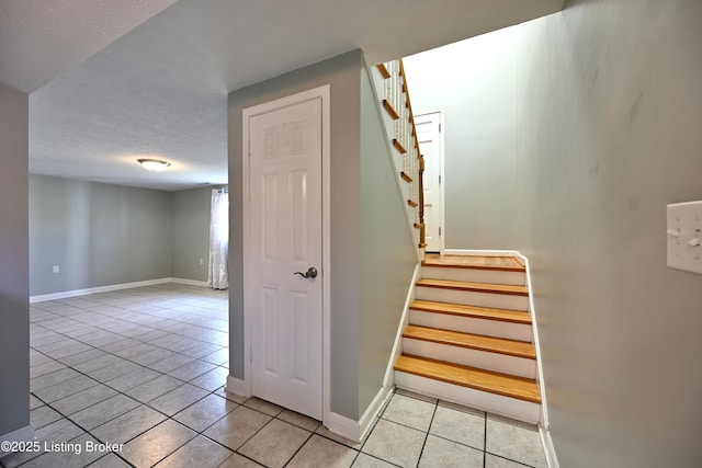 7514 Pimlico Dr, Louisville, KY 40214 - stairs with tile patterned floors and baseboards