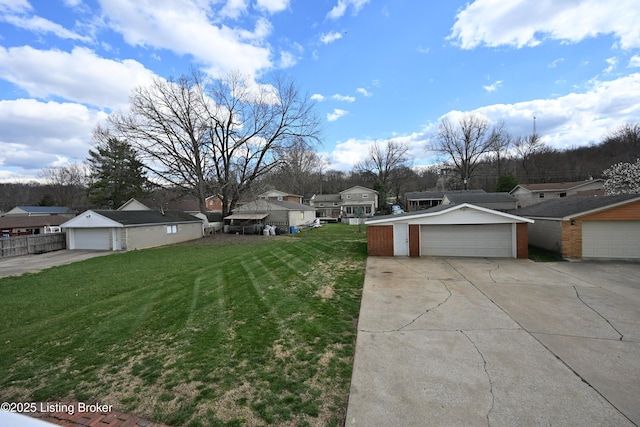 7514 Pimlico Dr, Louisville, KY 40214 - view of grassy yard with a residential view and a detached garage
