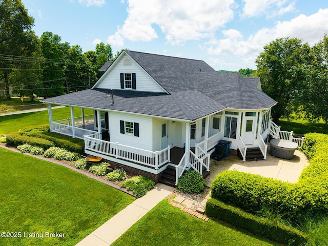 966 Lawrence St, Brandenburg, KY 40108 - rear view of house featuring roof with shingles, a yard, and a porch