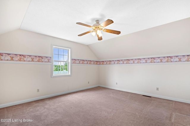 966 Lawrence St, Brandenburg, KY 40108 - carpeted spare room with lofted ceiling, a ceiling fan, and baseboards