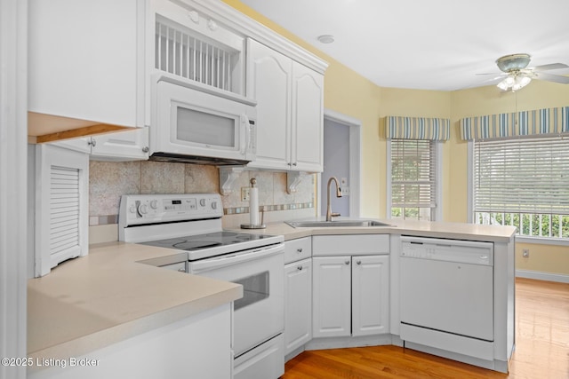 966 Lawrence St, Brandenburg, KY 40108 - kitchen featuring white appliances, a sink, a peninsula, a ceiling fan, and light countertops