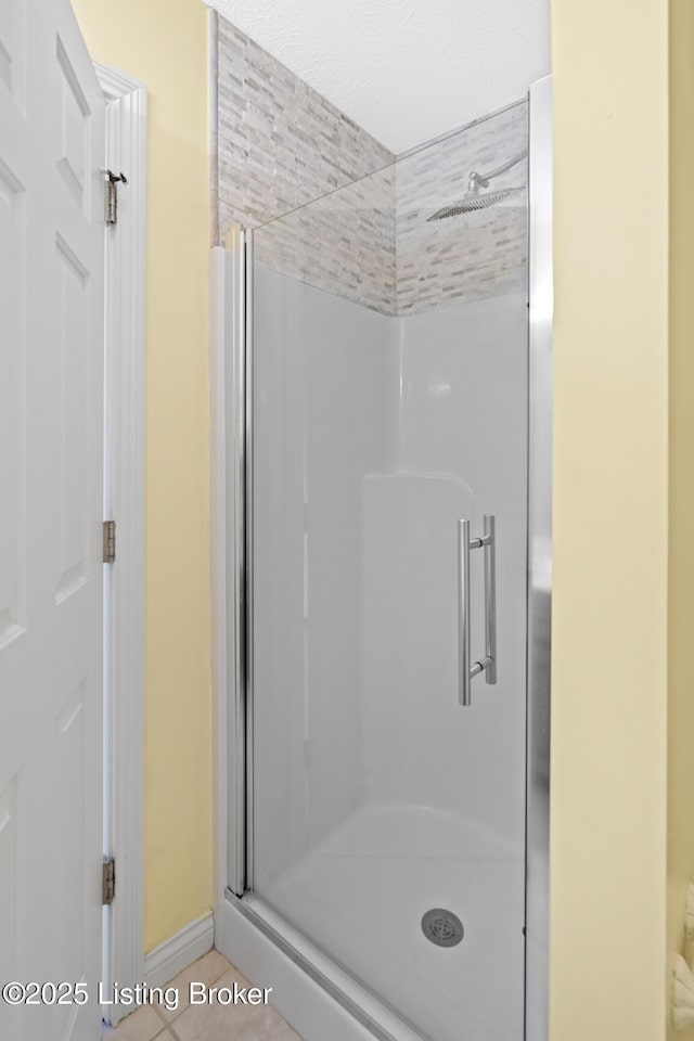 966 Lawrence St, Brandenburg, KY 40108 - bathroom featuring a stall shower, tile patterned floors, and baseboards