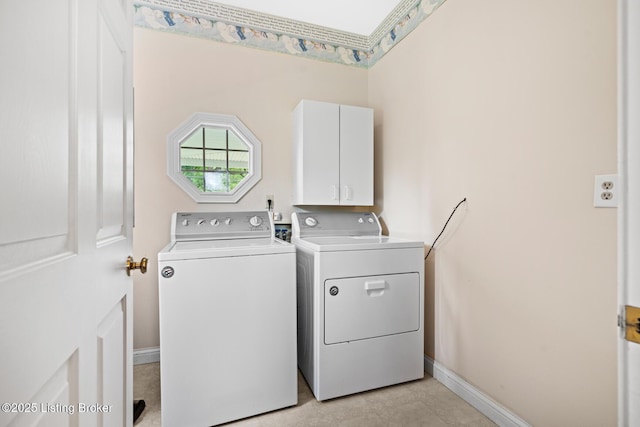 966 Lawrence St, Brandenburg, KY 40108 - laundry room featuring cabinet space, separate washer and dryer, and baseboards