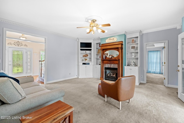 966 Lawrence St, Brandenburg, KY 40108 - living room with light carpet, ornamental molding, a ceiling fan, a fireplace, and baseboards