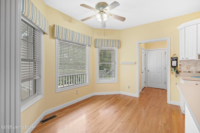 966 Lawrence St, Brandenburg, KY 40108 - unfurnished room with light wood finished floors, a ceiling fan, and baseboards