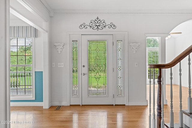 966 Lawrence St, Brandenburg, KY 40108 - entrance foyer with stairway, plenty of natural light, wood finished floors, and crown molding