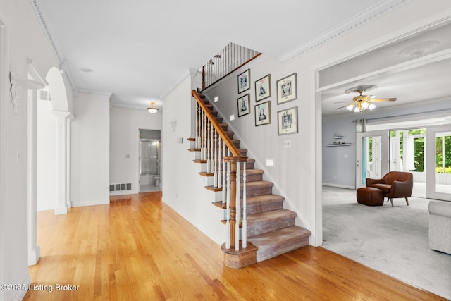 966 Lawrence St, Brandenburg, KY 40108 - staircase featuring crown molding, ceiling fan, baseboards, and wood finished floors