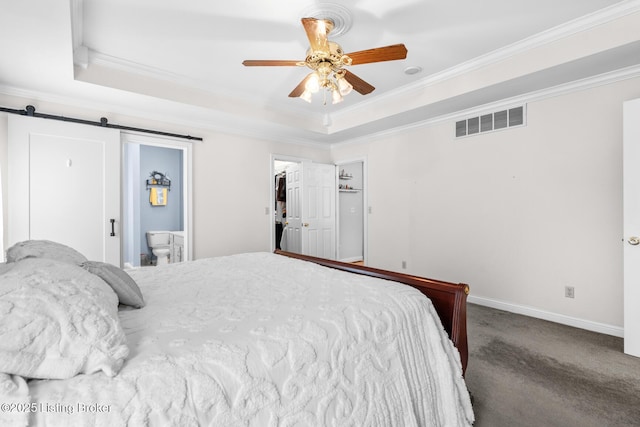 966 Lawrence St, Brandenburg, KY 40108 - bedroom with ornamental molding, a tray ceiling, a barn door, baseboards, and ensuite bathroom