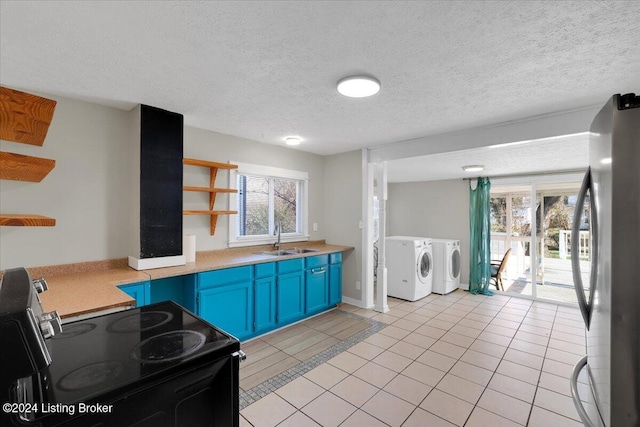 621 S 41st St, Louisville, KY 40211 - kitchen with open shelves, freestanding refrigerator, blue cabinets, electric range, and washer and clothes dryer