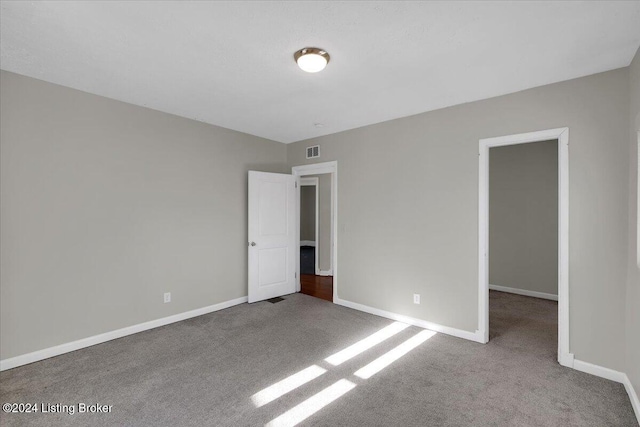 621 S 41st St, Louisville, KY 40211 - unfurnished bedroom featuring carpet flooring and baseboards