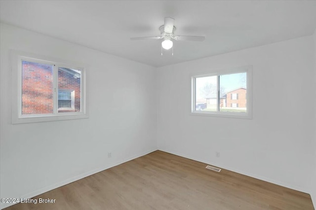 4104 Hispanyola Ct, Louisville, KY 40229 - empty room with wood finished floors, ceiling fan, and baseboards