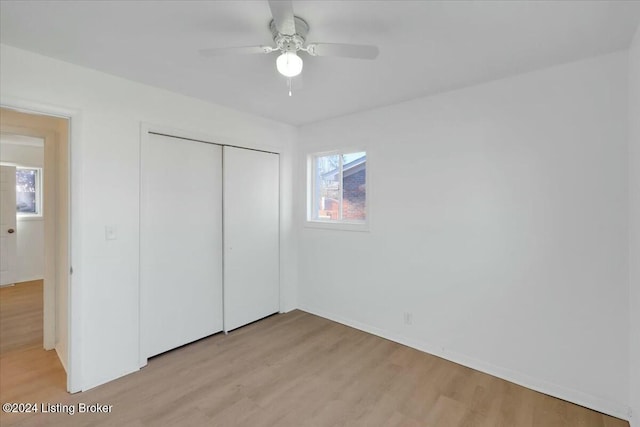 4104 Hispanyola Ct, Louisville, KY 40229 - unfurnished bedroom with light wood-style floors, a closet, baseboards, and ceiling fan