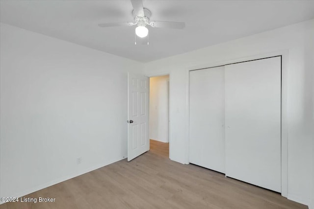 4104 Hispanyola Ct, Louisville, KY 40229 - unfurnished bedroom with wood finished floors, a closet, and ceiling fan