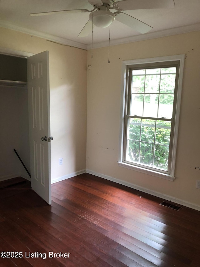 5902 Pageant Way, Louisville, KY 40214 - unfurnished bedroom with dark wood-style flooring, baseboards, crown molding, a closet, and a ceiling fan