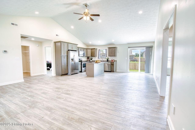 305 Valhalla Trce, Vine Grove, KY 40175 - kitchen featuring appliances with stainless steel finishes, open floor plan, a center island, light wood-type flooring, and baseboards