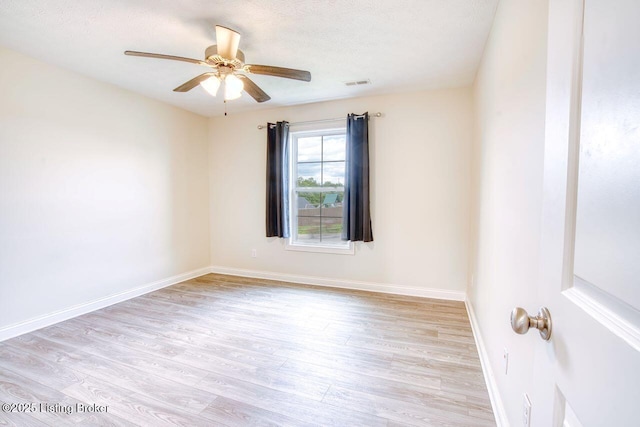 305 Valhalla Trce, Vine Grove, KY 40175 - unfurnished room with wood finished floors, ceiling fan, baseboards, and a textured ceiling