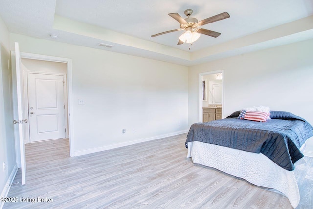305 Valhalla Trce, Vine Grove, KY 40175 - bedroom with light wood-style flooring, baseboards, a tray ceiling, and ceiling fan