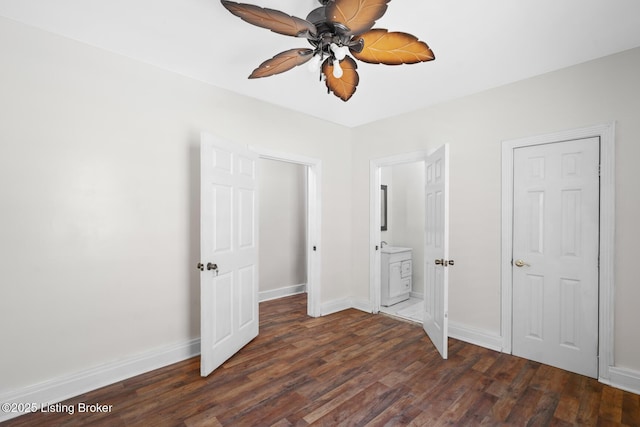 823 S Jackson St, Louisville, KY 40203 - unfurnished bedroom with dark wood-style flooring, baseboards, ensuite bathroom, and ceiling fan