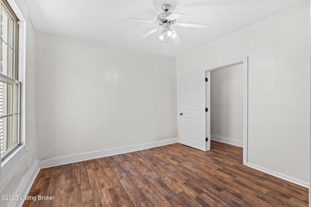 823 S Jackson St, Louisville, KY 40203 - spare room with dark wood-style flooring, baseboards, and a ceiling fan