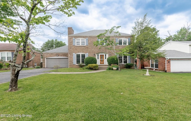 7212 Peppermill Ct, Louisville, KY 40228 - view of front of house with a garage, driveway, a chimney, and a front lawn