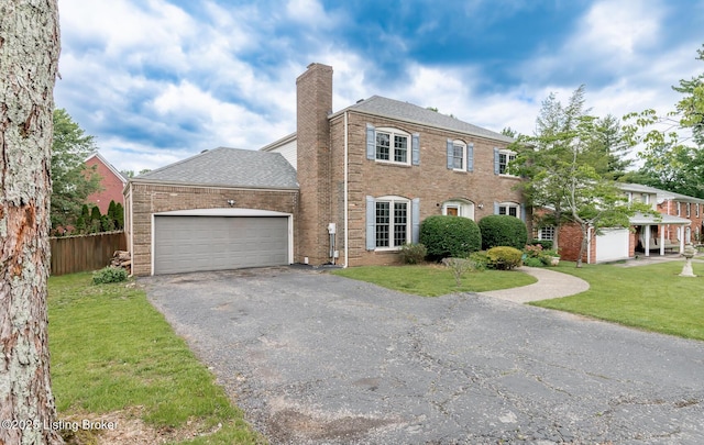7212 Peppermill Ct, Louisville, KY 40228 - view of front of property with asphalt driveway, a garage, a chimney, brick siding, and roof with shingles