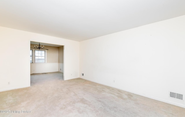 7212 Peppermill Ct, Louisville, KY 40228 - spare room featuring a chandelier, light colored carpet, and baseboards