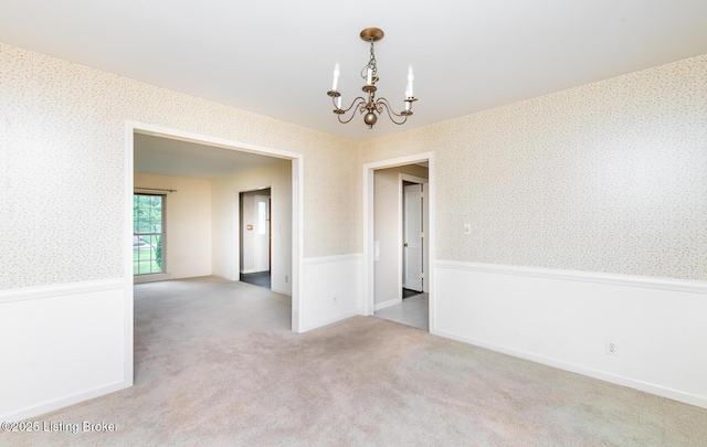 7212 Peppermill Ct, Louisville, KY 40228 - unfurnished room featuring wallpapered walls, a chandelier, wainscoting, and carpet floors