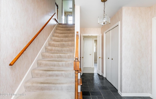 7212 Peppermill Ct, Louisville, KY 40228 - staircase with stone finish flooring, baseboards, and wallpapered walls