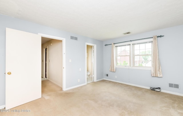 7212 Peppermill Ct, Louisville, KY 40228 - unfurnished bedroom with light carpet, baseboards, and connected bathroom