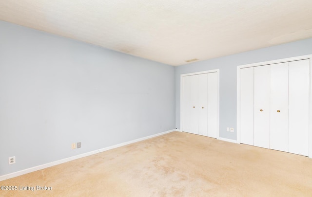 7212 Peppermill Ct, Louisville, KY 40228 - unfurnished bedroom with multiple closets, carpet floors, and baseboards