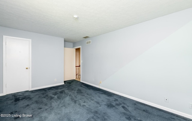 7212 Peppermill Ct, Louisville, KY 40228 - unfurnished room with baseboards, dark carpet, a textured ceiling, and a smoke detector
