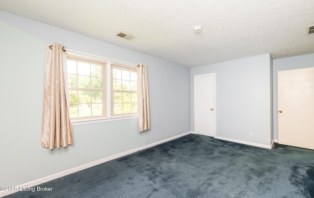 7212 Peppermill Ct, Louisville, KY 40228 - spare room with dark colored carpet, baseboards, a textured ceiling, and a smoke detector