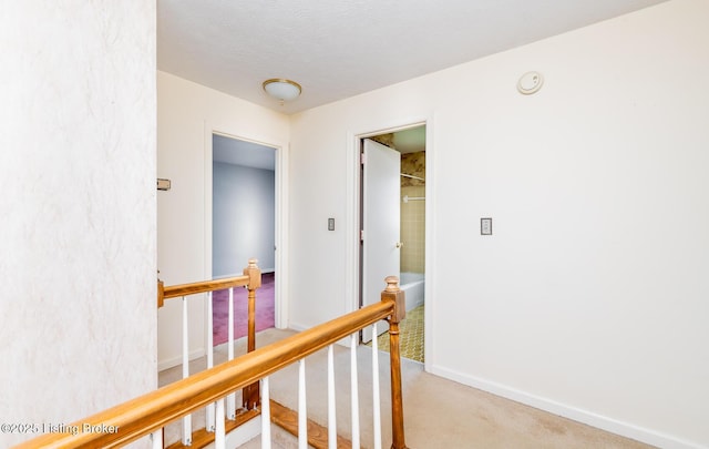 7212 Peppermill Ct, Louisville, KY 40228 - hallway with an upstairs landing, carpet flooring, baseboards, and a textured ceiling
