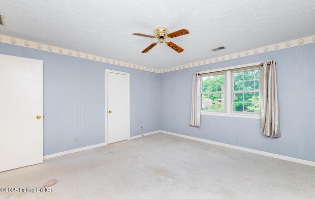 7212 Peppermill Ct, Louisville, KY 40228 - empty room with ceiling fan, carpet, baseboards, and a textured ceiling