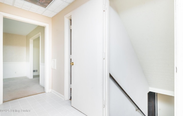 7212 Peppermill Ct, Louisville, KY 40228 - hallway with an upstairs landing, light carpet, and baseboards