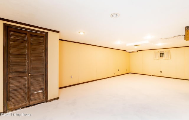 7212 Peppermill Ct, Louisville, KY 40228 - finished below grade area with light carpet, crown molding, recessed lighting, and baseboards
