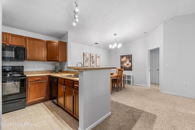 2603 Callery Pl Unit 301, Louisville, KY 40299 - kitchen with black appliances, a peninsula, a chandelier, brown cabinets, and lofted ceiling