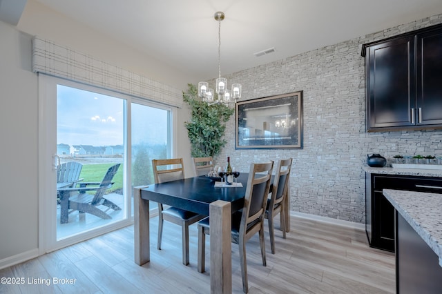 101 Exploration Unit 61A, Shelbyville, KY 40065 - dining area featuring a chandelier, light wood-style floors, and baseboards