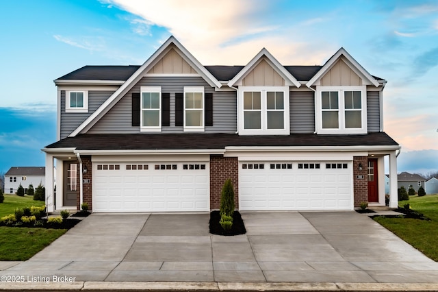 101 Exploration Unit 61A, Shelbyville, KY 40065 - view of front of home with concrete driveway, an attached garage, and brick siding
