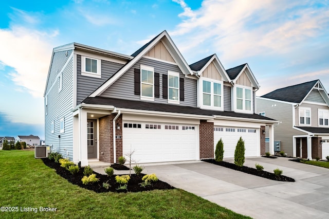 101 Exploration Unit 61A, Shelbyville, KY 40065 - view of front of property featuring an attached garage, driveway, a front lawn, and brick siding