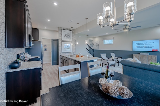 101 Exploration Unit 61A, Shelbyville, KY 40065 - kitchen featuring a sink, ceiling fan, stainless steel appliances, dark brown cabinets, and pendant lighting