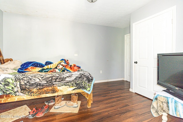 1407 Bluegrass Ave, Louisville, KY 40215 - bedroom with dark wood-style flooring and baseboards