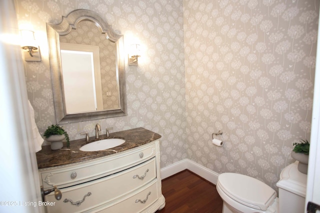 15314 Crystal Springs Way, Louisville, KY 40245 - half bathroom featuring wood finished floors, wallpapered walls, vanity, baseboards, and toilet