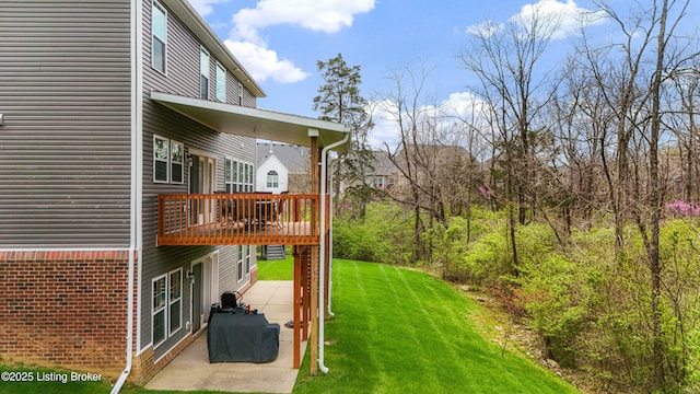 18001 Teton Ridge Ct, Louisville, KY 40245 - view of green lawn with a patio area and a deck